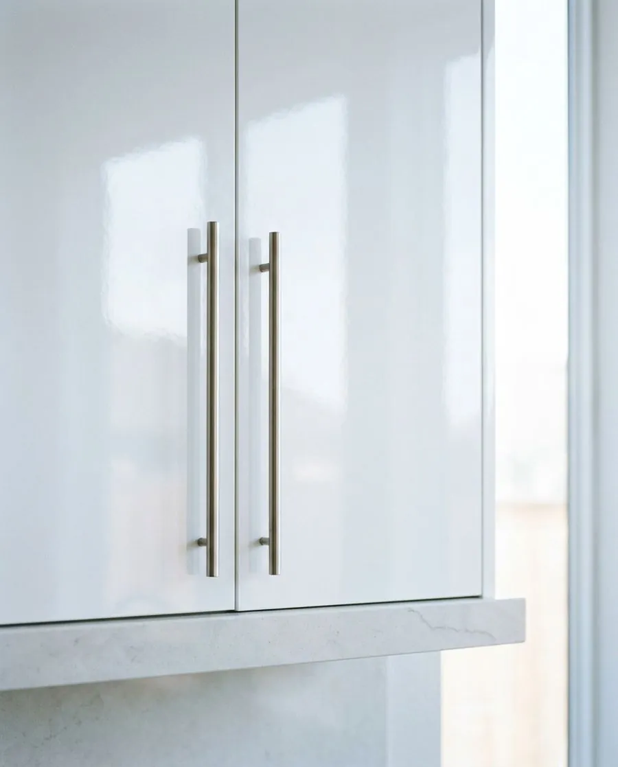 White baseboard and clean cabinet door after house cleaning in Irving